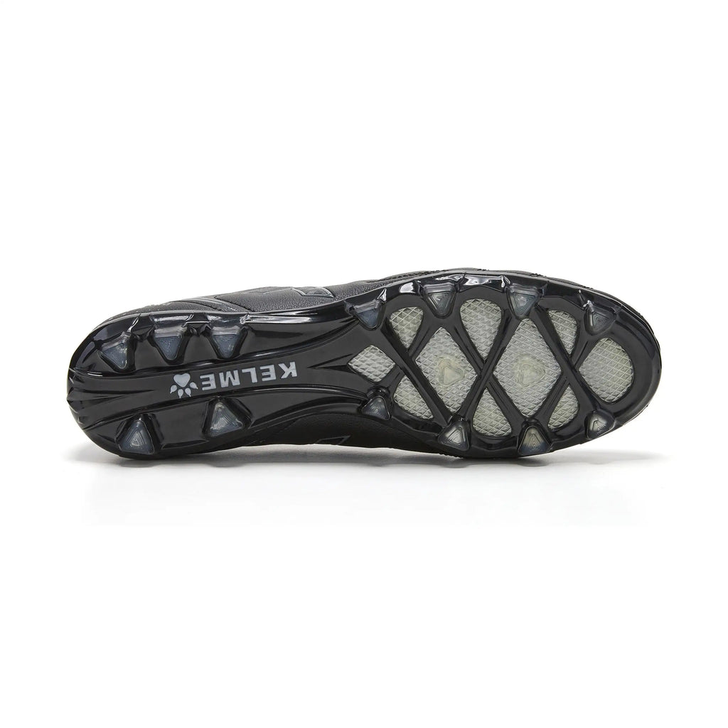 Kelme New Millenia Black Soccer Boots - 100% synthetic leather, modern design, lightweight for speed, with traction technology for optimal grip, perfect for players of all levels in Spring/Summer 2025.