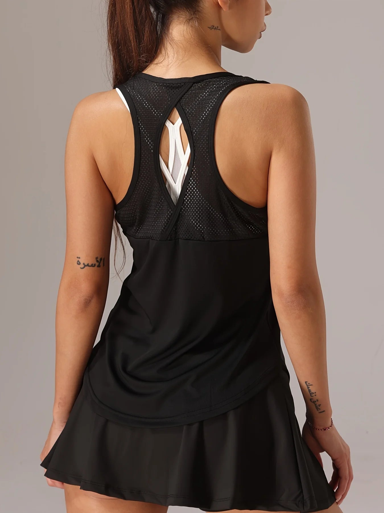 Camiseta deportiva sin mangas para mujer - Espalda de malla y diseño cruzado